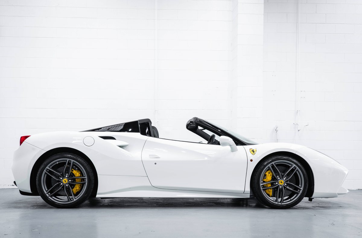 Ferrari 488 Spider in profile with the roof open